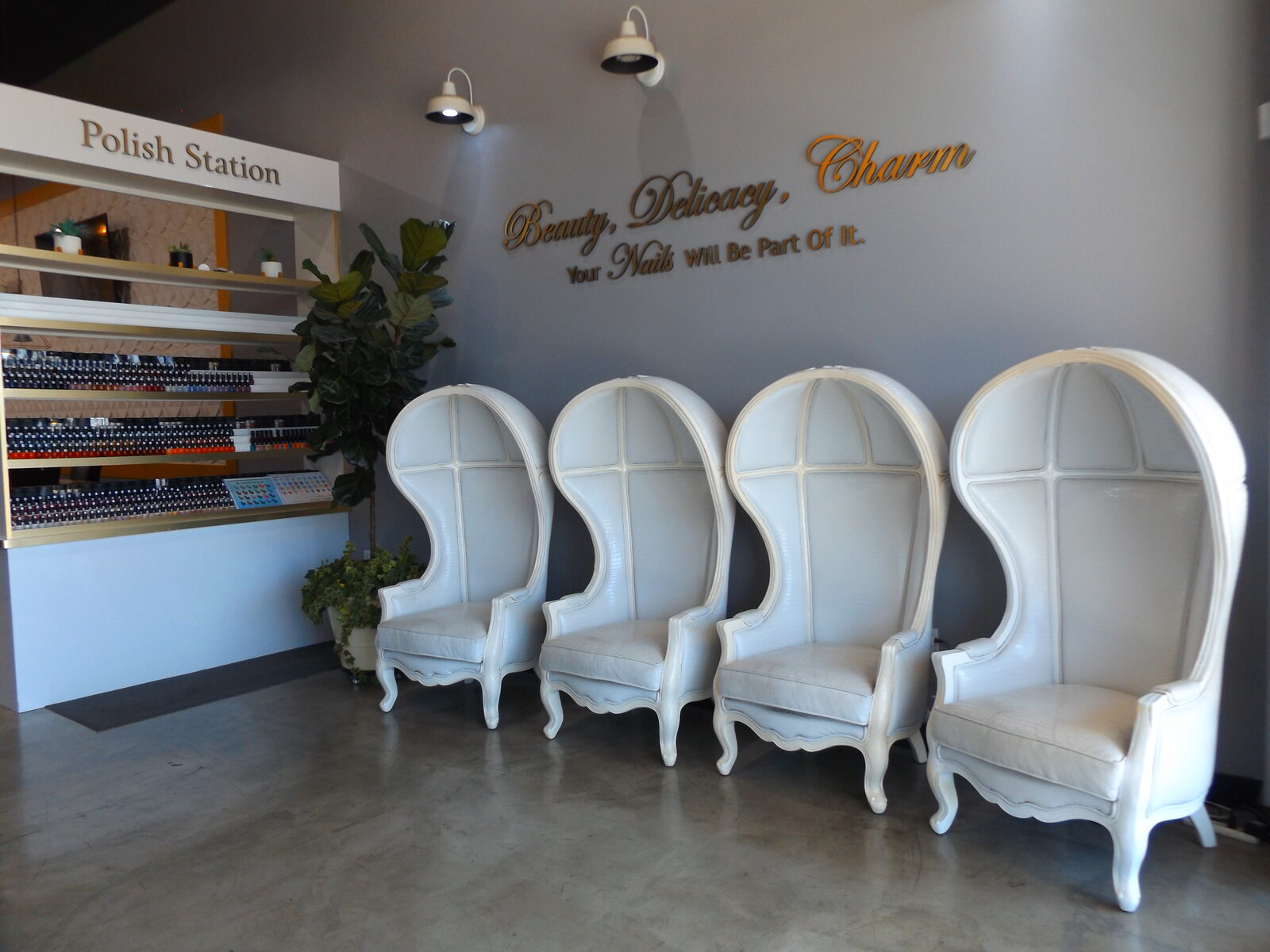 Blossom's Nails Boutique waiting lounge with canopy chairs