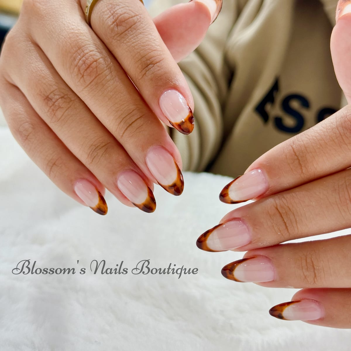 Almond nails with tortoiseshell French tips at Blossom's Nails Boutique
